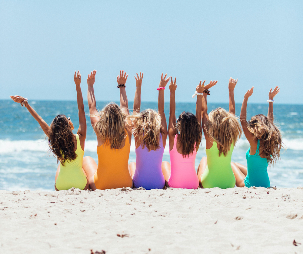 Girls on beach representing Group Travel from Harvey Travel Waterford